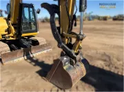 2018 Caterpillar 308E2 CR mini excavator with compact radius, swing boom, and high-definition hydraulic system for confined space construction and trenching.