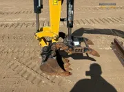 2020 Caterpillar 301.8 mini excavator with expandable undercarriage, stick steer travel mode, and tilt-up canopy for easy maintenance in tight construction spaces.