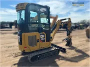 2020 Caterpillar 301.8 mini excavator with expandable undercarriage, stick steer travel mode, and tilt-up canopy for easy maintenance in tight construction spaces.