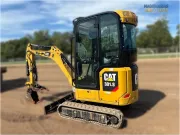 2020 Caterpillar 301.8 mini excavator with expandable undercarriage, stick steer travel mode, and tilt-up canopy for easy maintenance in tight construction spaces.