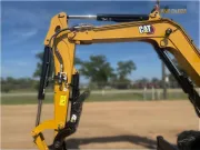 2024 Caterpillar 305 CR mini excavator with compact radius, stick steer travel mode, and high-performance hydraulics for precision digging and utility work.