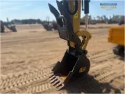 2024 Caterpillar 305 CR mini excavator with compact radius, stick steer travel mode, and high-performance hydraulics for precision digging and utility work.