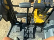 2024 Caterpillar 305 CR mini excavator with compact radius, stick steer travel mode, and high-performance hydraulics for precision digging and utility work.