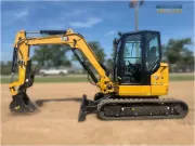 2024 Caterpillar 305 CR mini excavator with compact radius, stick steer travel mode, and high-performance hydraulics for precision digging and utility work.