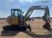 2024 Caterpillar 305 CR mini excavator with compact radius, stick steer travel mode, and high-performance hydraulics for precision digging and utility work.