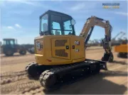 2024 Caterpillar 305 CR mini excavator with compact radius, stick steer travel mode, and high-performance hydraulics for precision digging and utility work.