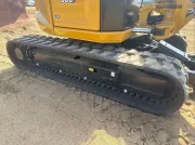 2024 Caterpillar 305 CR mini excavator with compact radius, stick steer travel mode, and high-performance hydraulics for precision digging and utility work.